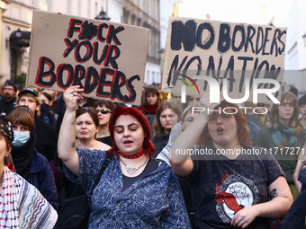 People attend a demonstration against the Polish government's plans to suspend the right to asylum for refugees illegally crossing the Polis...