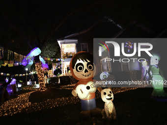 In the backyards of houses in the Celebration, FL, region, people create scary scenes with inflatable and luminous dolls for Halloween on Su...