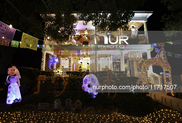 In the backyards of houses in the Celebration, FL, region, people create scary scenes with inflatable and luminous dolls for Halloween on Su...