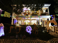 In the backyards of houses in the Celebration, FL, region, people create scary scenes with inflatable and luminous dolls for Halloween on Su...