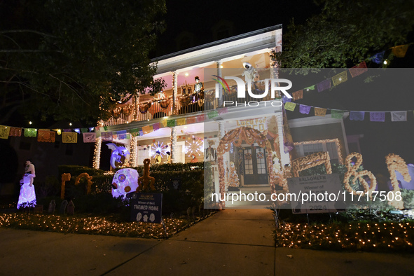 In the backyards of houses in the Celebration, FL, region, people create scary scenes with inflatable and luminous dolls for Halloween on Su...