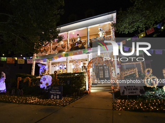 In the backyards of houses in the Celebration, FL, region, people create scary scenes with inflatable and luminous dolls for Halloween on Su...