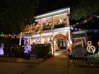 In the backyards of houses in the Celebration, FL, region, people create scary scenes with inflatable and luminous dolls for Halloween on Su...