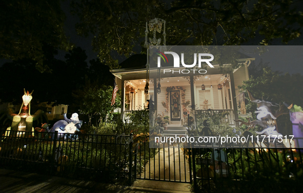 In the backyards of houses in the Celebration, FL, region, people create scary scenes with inflatable and luminous dolls for Halloween on Su...