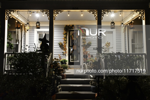 In the backyards of houses in the Celebration, FL, region, people create scary scenes with inflatable and luminous dolls for Halloween on Su...