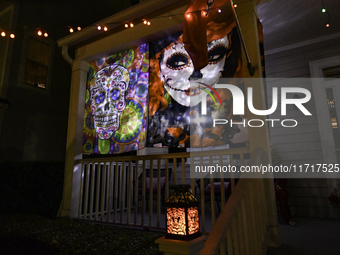 In the backyards of houses in the Celebration, FL, region, people create scary scenes with inflatable and luminous dolls for Halloween on Su...