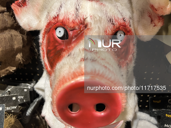 A pig mask is displayed at a shop selling costumes in preparation for Halloween in Toronto, Ontario, Canada, on September 27, 2024. 