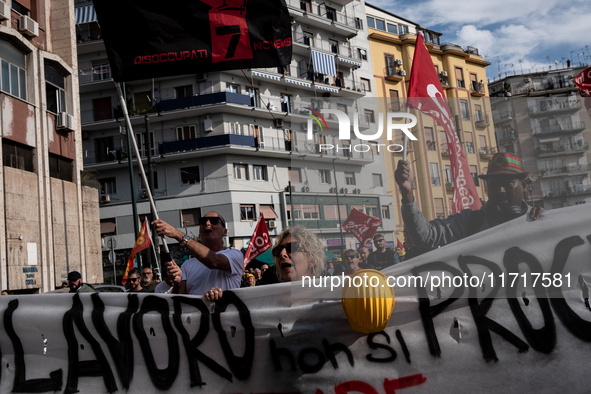 A demonstration takes place in Naples, Italy, outside the Poggioreale prison, where unemployed and working people gather to protest against...