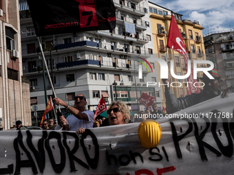 A demonstration takes place in Naples, Italy, outside the Poggioreale prison, where unemployed and working people gather to protest against...