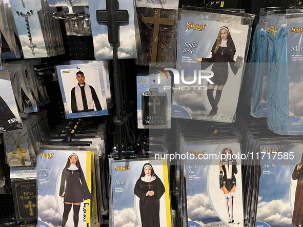 Halloween costumes and costume accessories are displayed at a shop in preparation for Halloween in Toronto, Ontario, Canada, on September 27...