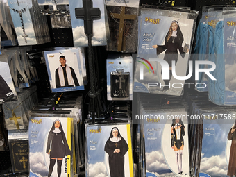 Halloween costumes and costume accessories are displayed at a shop in preparation for Halloween in Toronto, Ontario, Canada, on September 27...