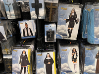 Halloween costumes and costume accessories are displayed at a shop in preparation for Halloween in Toronto, Ontario, Canada, on September 27...