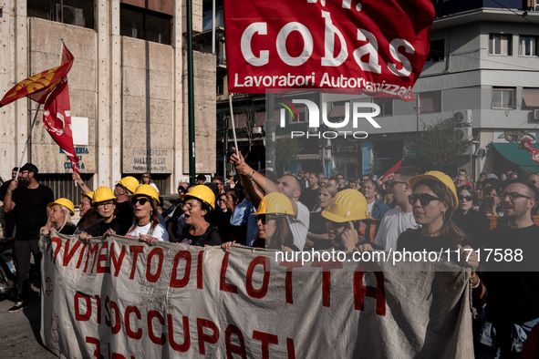 A demonstration takes place in Naples, Italy, outside the Poggioreale prison, where unemployed and working people gather to protest against...