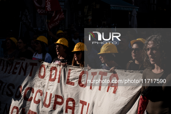 A demonstration takes place in Naples, Italy, outside the Poggioreale prison, where unemployed and working people gather to protest against...