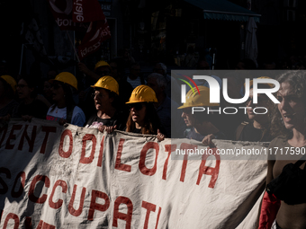 A demonstration takes place in Naples, Italy, outside the Poggioreale prison, where unemployed and working people gather to protest against...