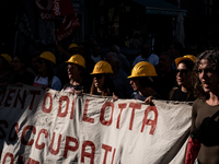 A demonstration takes place in Naples, Italy, outside the Poggioreale prison, where unemployed and working people gather to protest against...