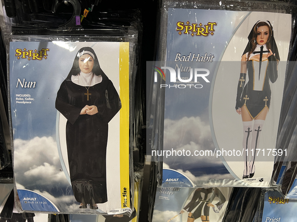 Halloween costumes and costume accessories are displayed at a shop in preparation for Halloween in Toronto, Ontario, Canada, on September 27...