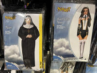 Halloween costumes and costume accessories are displayed at a shop in preparation for Halloween in Toronto, Ontario, Canada, on September 27...