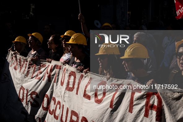 A demonstration takes place in Naples, Italy, outside the Poggioreale prison, where unemployed and working people gather to protest against...