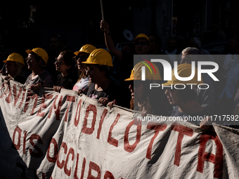 A demonstration takes place in Naples, Italy, outside the Poggioreale prison, where unemployed and working people gather to protest against...