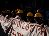 A demonstration takes place in Naples, Italy, outside the Poggioreale prison, where unemployed and working people gather to protest against...