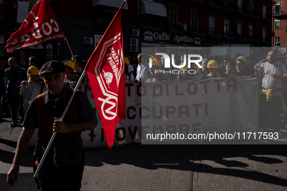 A demonstration takes place in Naples, Italy, outside the Poggioreale prison, where unemployed and working people gather to protest against...