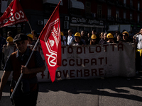 A demonstration takes place in Naples, Italy, outside the Poggioreale prison, where unemployed and working people gather to protest against...