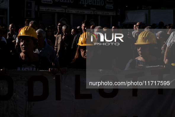 A demonstration takes place in Naples, Italy, outside the Poggioreale prison, where unemployed and working people gather to protest against...