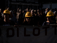 A demonstration takes place in Naples, Italy, outside the Poggioreale prison, where unemployed and working people gather to protest against...