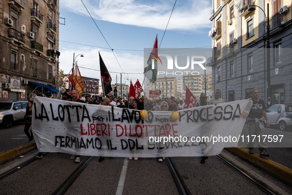 A demonstration takes place in Naples, Italy, outside the Poggioreale prison, where unemployed and working people gather to protest against...