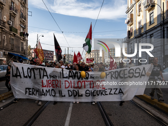 A demonstration takes place in Naples, Italy, outside the Poggioreale prison, where unemployed and working people gather to protest against...