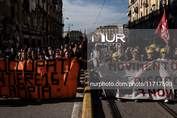 A demonstration takes place in Naples, Italy, outside the Poggioreale prison, where unemployed and working people gather to protest against...