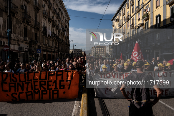 A demonstration takes place in Naples, Italy, outside the Poggioreale prison, where unemployed and working people gather to protest against...