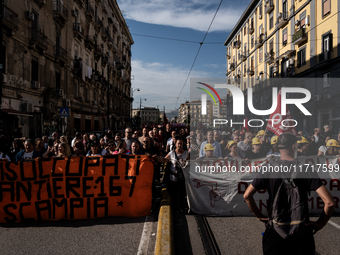 A demonstration takes place in Naples, Italy, outside the Poggioreale prison, where unemployed and working people gather to protest against...