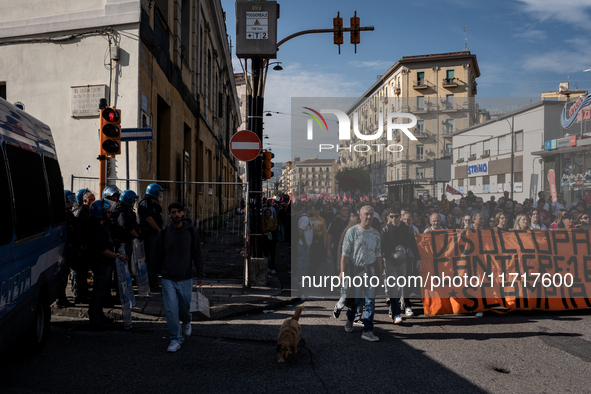 A demonstration takes place in Naples, Italy, outside the Poggioreale prison, where unemployed and working people gather to protest against...