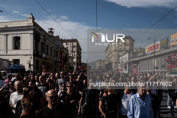 A demonstration takes place in Naples, Italy, outside the Poggioreale prison, where unemployed and working people gather to protest against...