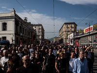 A demonstration takes place in Naples, Italy, outside the Poggioreale prison, where unemployed and working people gather to protest against...