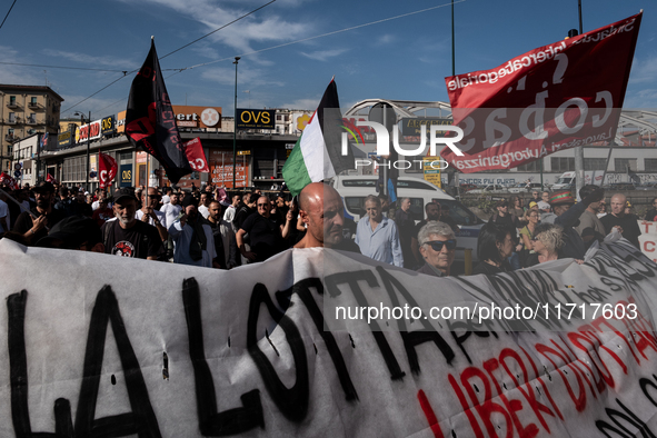 A demonstration takes place in Naples, Italy, outside the Poggioreale prison, where unemployed and working people gather to protest against...