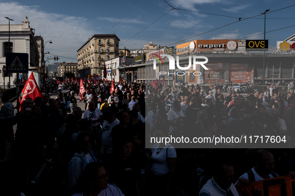 A demonstration takes place in Naples, Italy, outside the Poggioreale prison, where unemployed and working people gather to protest against...