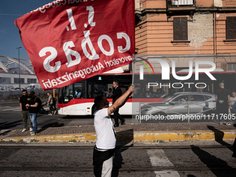 A demonstration takes place in Naples, Italy, outside the Poggioreale prison, where unemployed and working people gather to protest against...