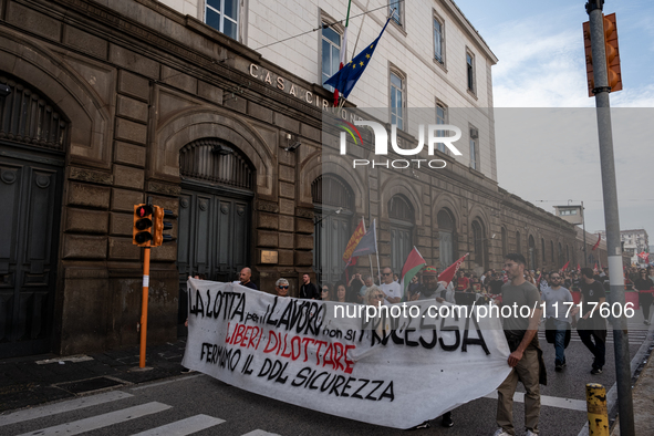 A demonstration takes place in Naples, Italy, outside the Poggioreale prison, where unemployed and working people gather to protest against...