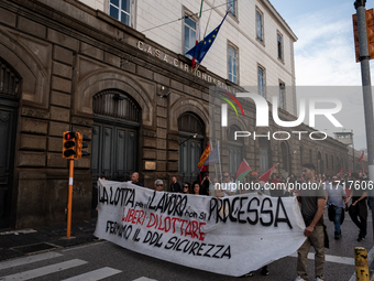 A demonstration takes place in Naples, Italy, outside the Poggioreale prison, where unemployed and working people gather to protest against...