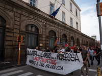 A demonstration takes place in Naples, Italy, outside the Poggioreale prison, where unemployed and working people gather to protest against...