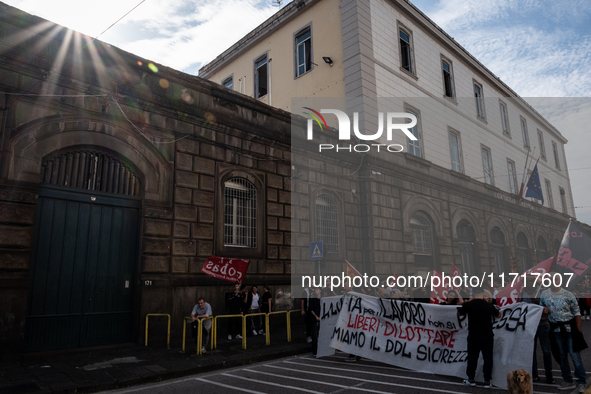 A demonstration takes place in Naples, Italy, outside the Poggioreale prison, where unemployed and working people gather to protest against...