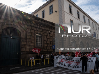 A demonstration takes place in Naples, Italy, outside the Poggioreale prison, where unemployed and working people gather to protest against...