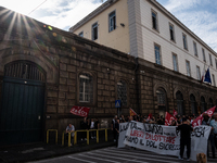 A demonstration takes place in Naples, Italy, outside the Poggioreale prison, where unemployed and working people gather to protest against...