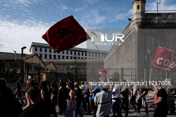 A demonstration takes place in Naples, Italy, outside the Poggioreale prison, where unemployed and working people gather to protest against...