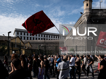 A demonstration takes place in Naples, Italy, outside the Poggioreale prison, where unemployed and working people gather to protest against...