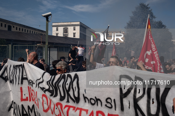 A demonstration takes place in Naples, Italy, outside the Poggioreale prison, where unemployed and working people gather to protest against...