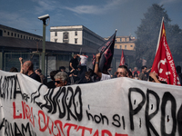 A demonstration takes place in Naples, Italy, outside the Poggioreale prison, where unemployed and working people gather to protest against...